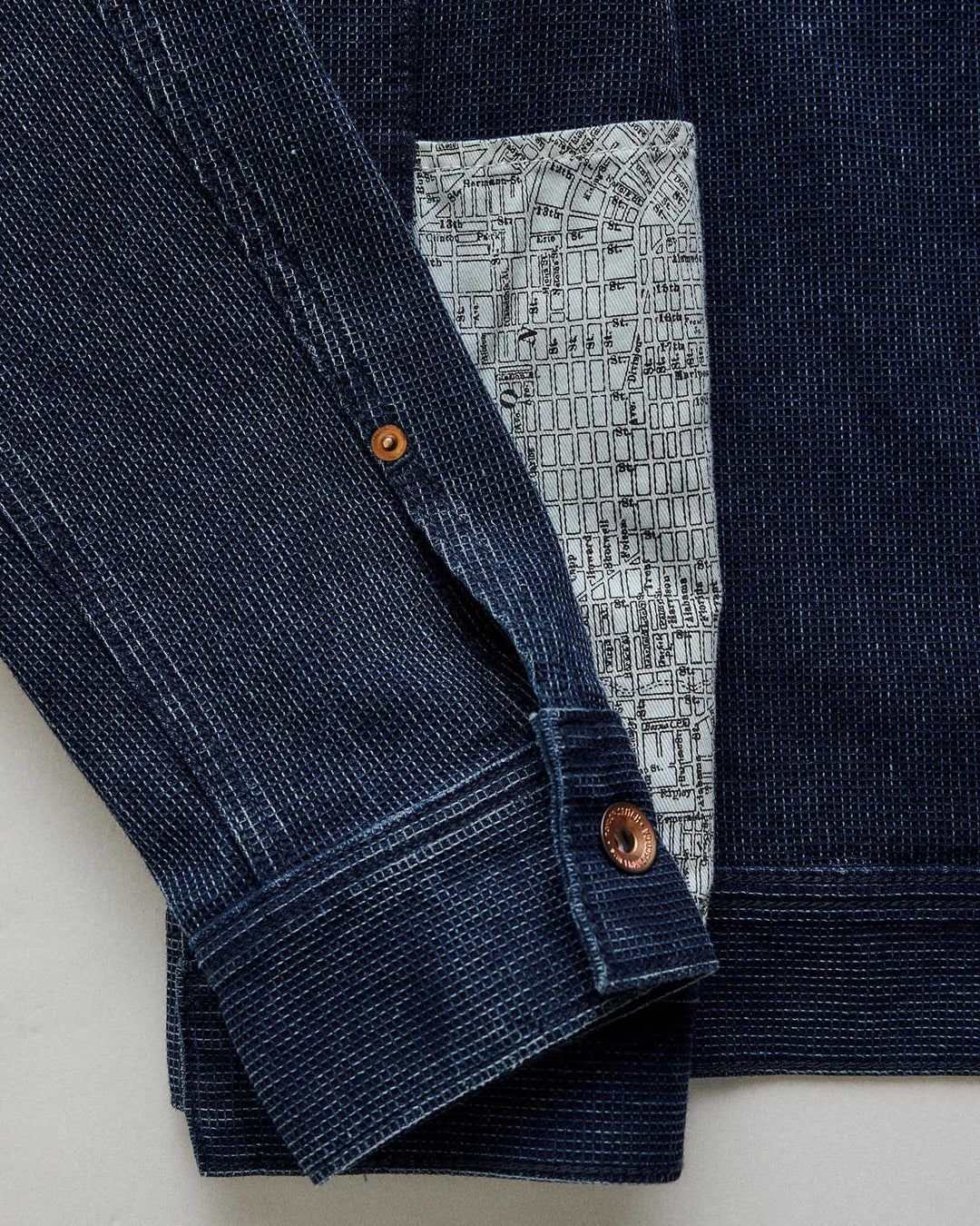 close up of jean jacket arm.