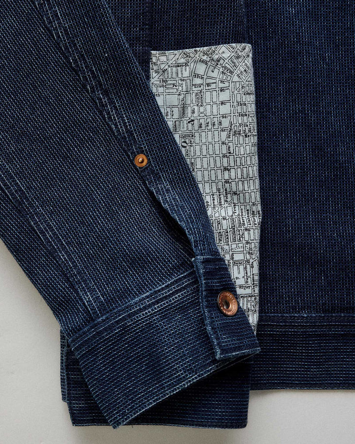 close up of jean jacket arm.
