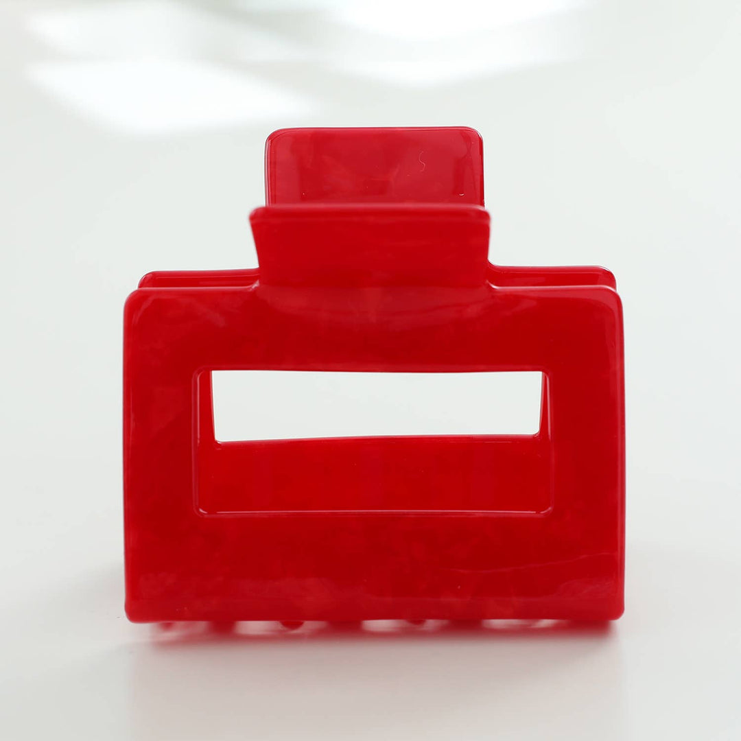 Red hair clip on a white background