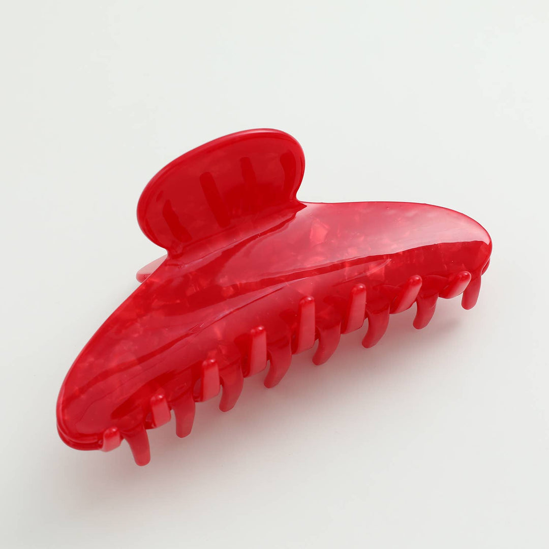 Red hair clip on a white background