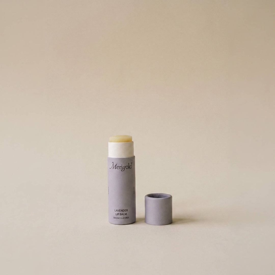 Lip balm with a light purple container on a beige background