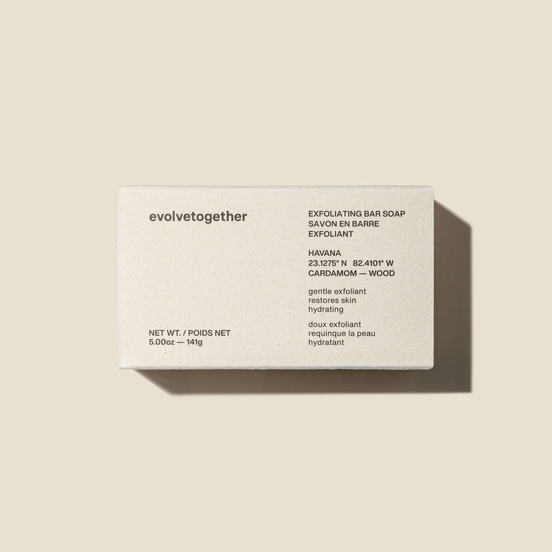Exfoliating bar soap packaging with brand name 'evolvetogether' on a beige background
