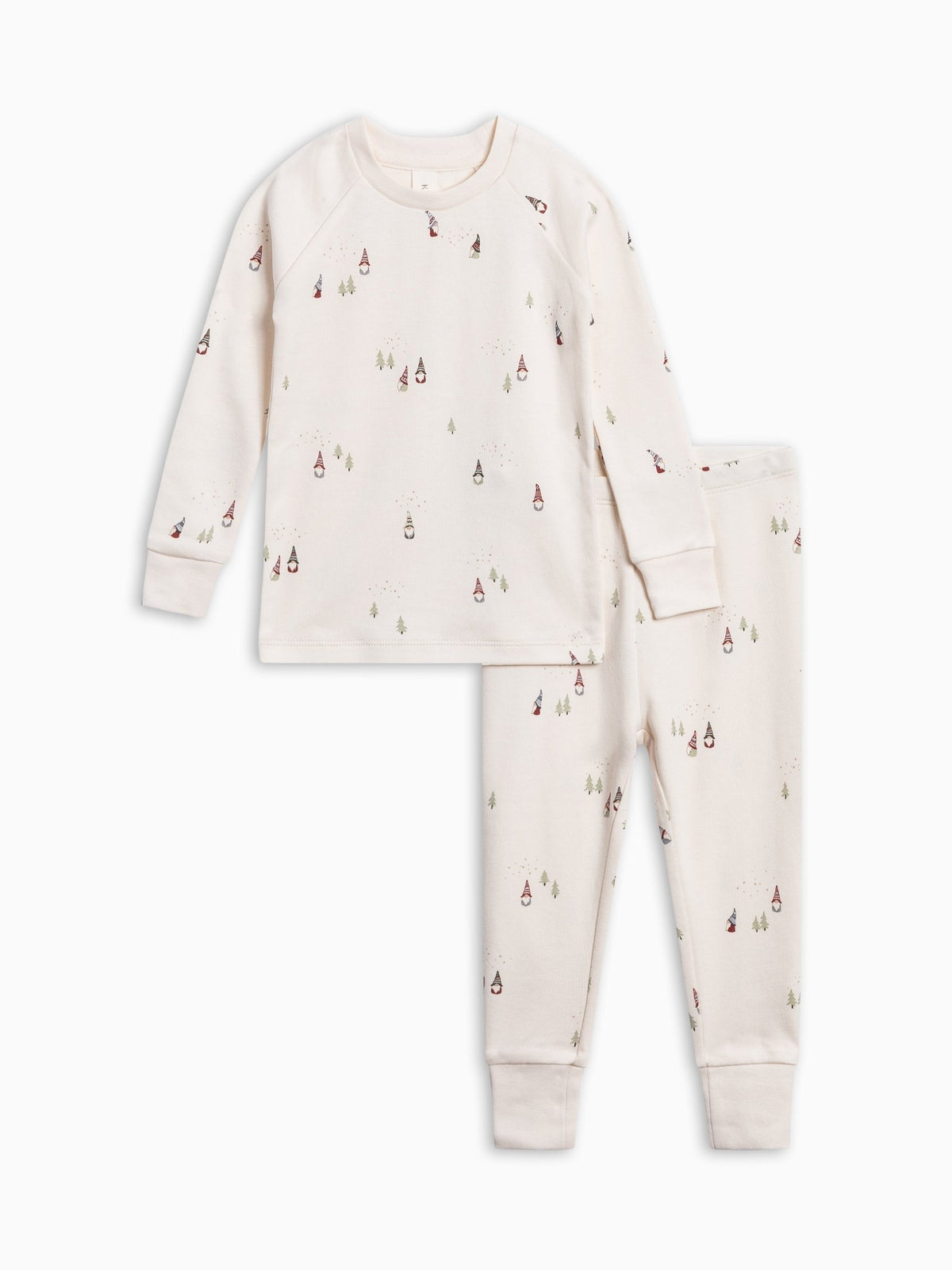 A 2 Piece Long Sleeve Jammie Set featuring a long-sleeve top and matching pants in a warm cream color, both printed with a small, scattered pattern of miniature red and green gnomes and trees, shown on a plain white background.