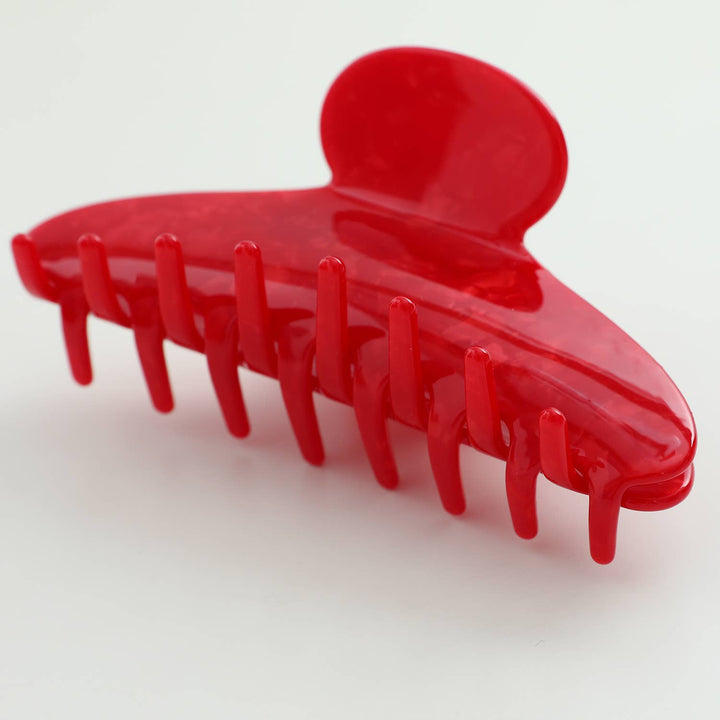 Red hair clip on a white background