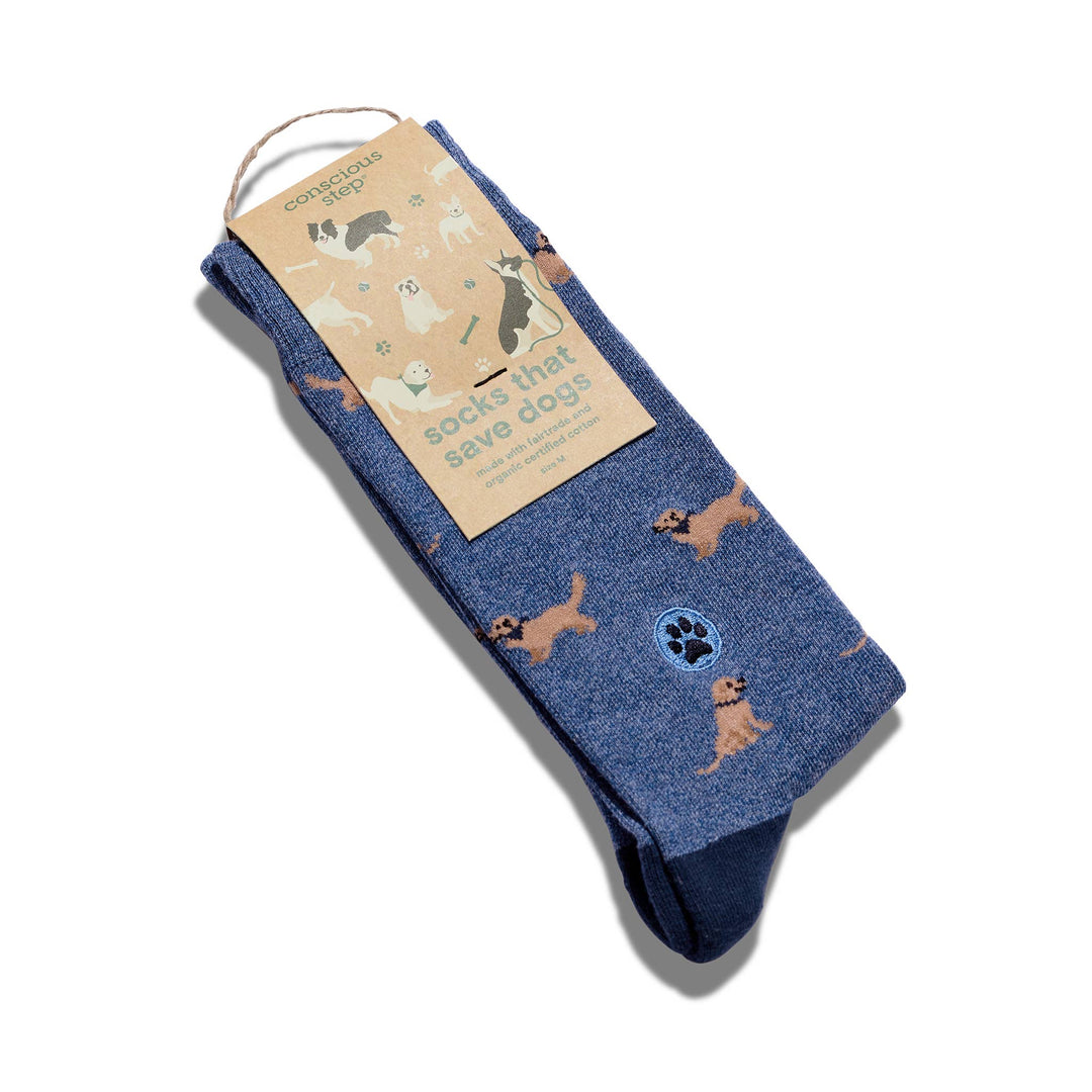 Blue socks with dog illustrations and packaging on a white background