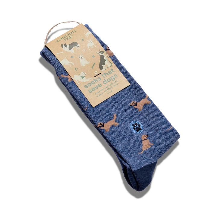 Blue socks with dog illustrations and packaging on a white background