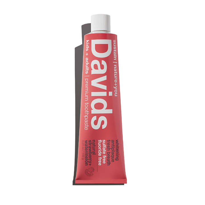Red toothpaste tube with 'Davids' branding on a white background