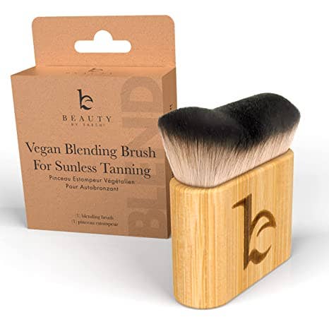 Vegan blending brush with wooden handle and brown packaging on a white background