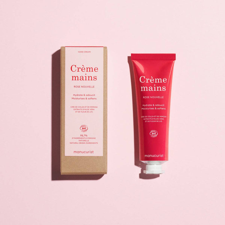Manucurist hand cream tube and packaging on a pink background
