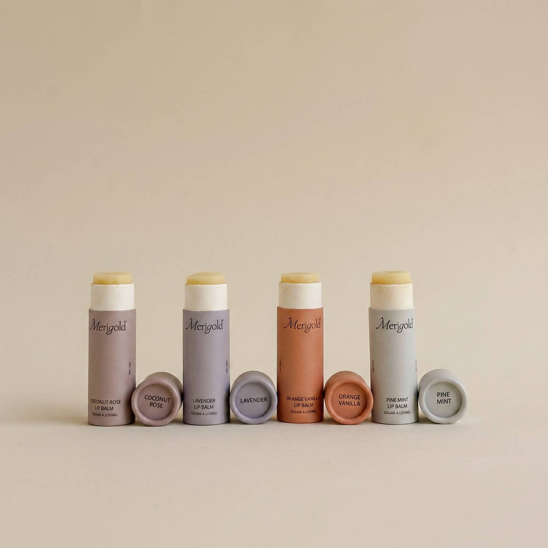 Set of lip balms with visible brand name on a beige background