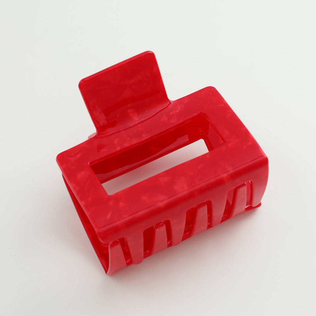 Red hair clip on a white background