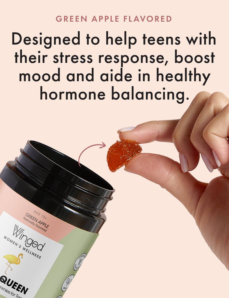 Winged product packaging with a hand holding a green apple-flavored supplement against a beige background.