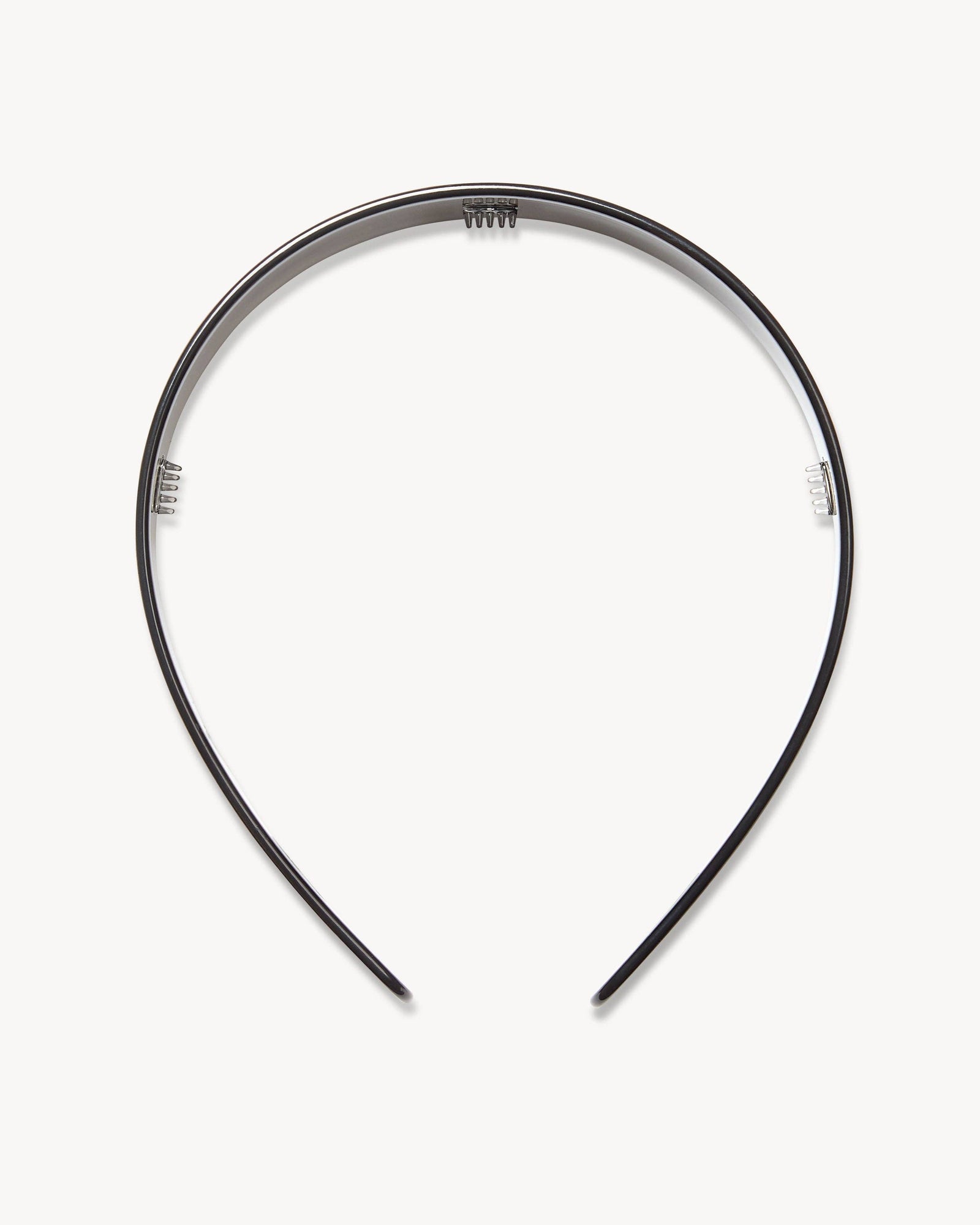 Machete's wide headband in black on a white surface.