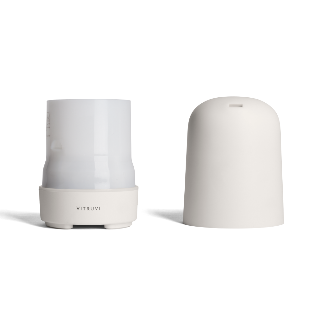 Top and bottom of the glow diffuser with 'Vitruvi' branding on a white background