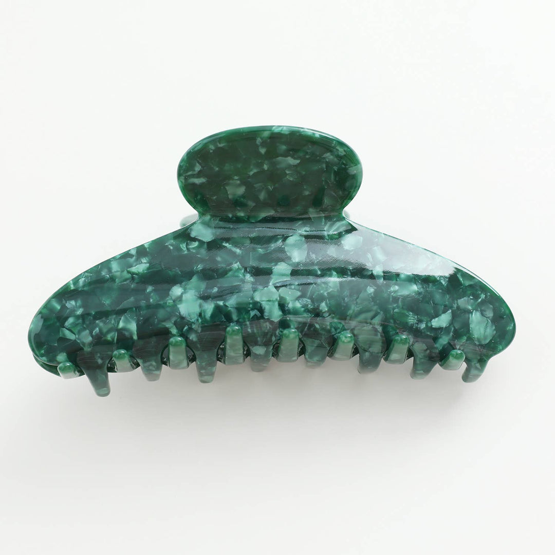 Green marbled hair clip on a white background