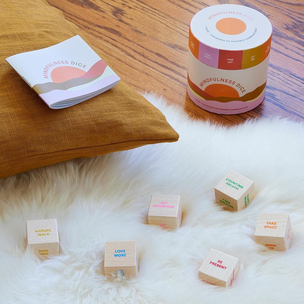 Mindfulness Dice game with dice and packaging on a soft surface