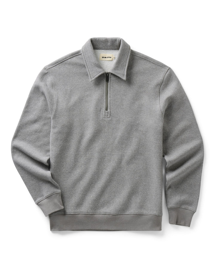 A light gray heathered quarter-zip pullover sweatshirt with a collar, shown flat against a white background.