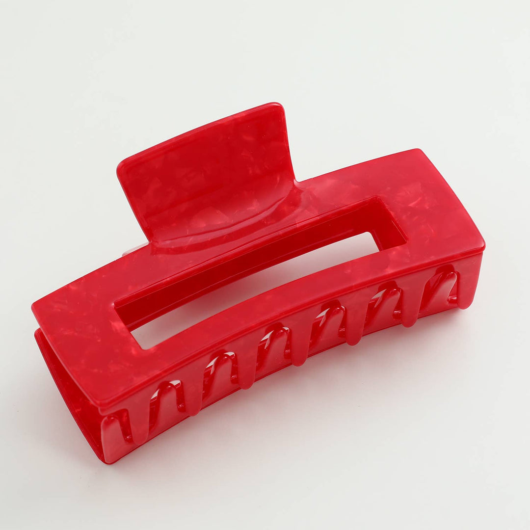 Red hair clip on a white background