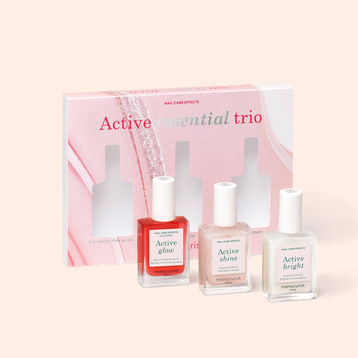 Three nail polish bottles with a packaging box labeled &