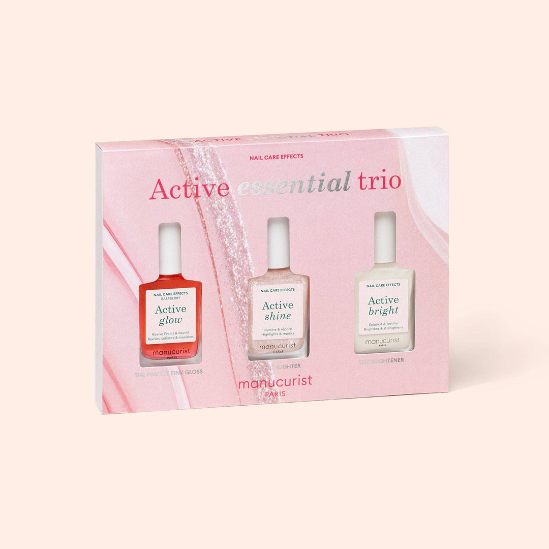 Manucurist Active Essential Trio nail care set with three bottles in a pink box on a light pink background