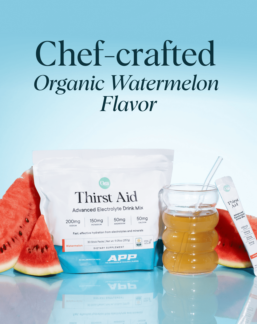 Thirst Aid organic watermelon flavor drink mix with watermelon slices and a glass of juice on a light blue background.