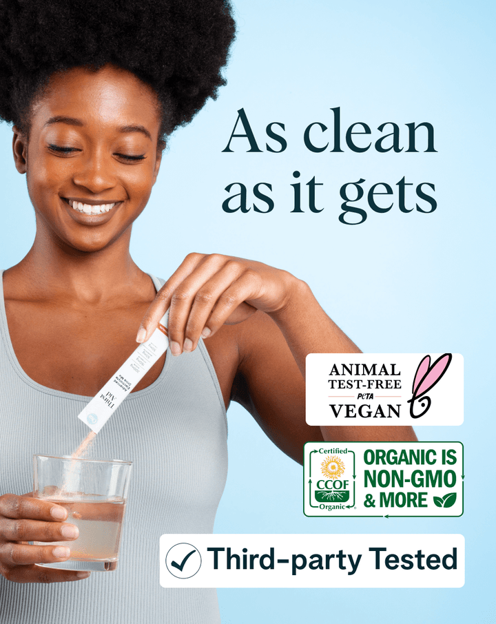 Woman pouring a supplement into a glass with certification logos on a light blue background