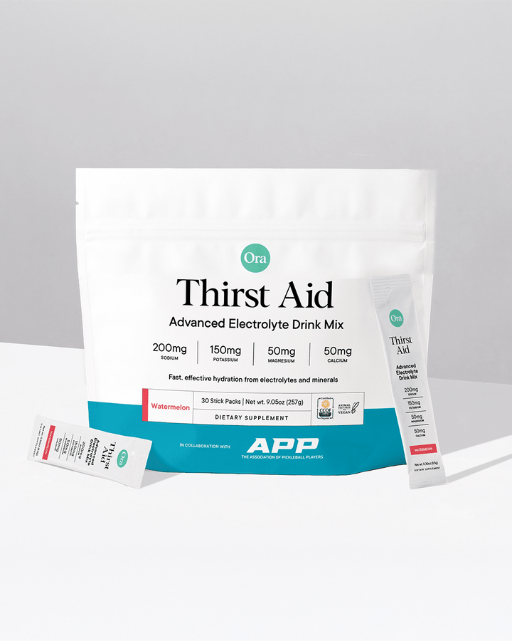 Ora Thirst Aid Advanced Electrolyte Drink Mix package on a gray background