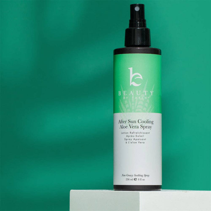 Beauty by Earths After Sun Cooling Aloe Vera Spray bottle on a green background