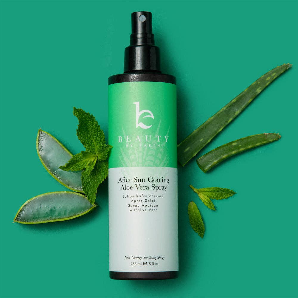 Green aloe vera spray bottle with leaves on a green background