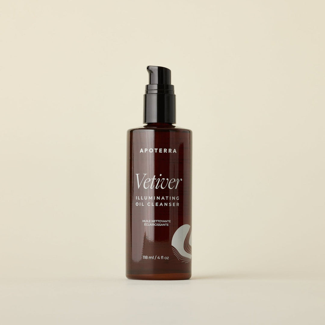 Brown bottle of Apoterra Vetiver Illuminating Oil Cleanser on a beige background