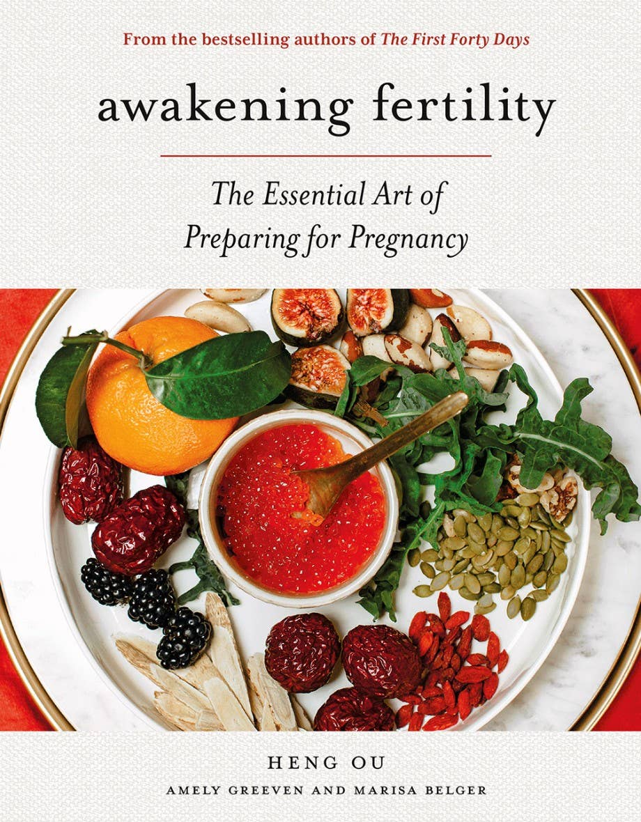 Book cover of 'Awakening Fertility' with a plate of fruits and vegetables on a white background