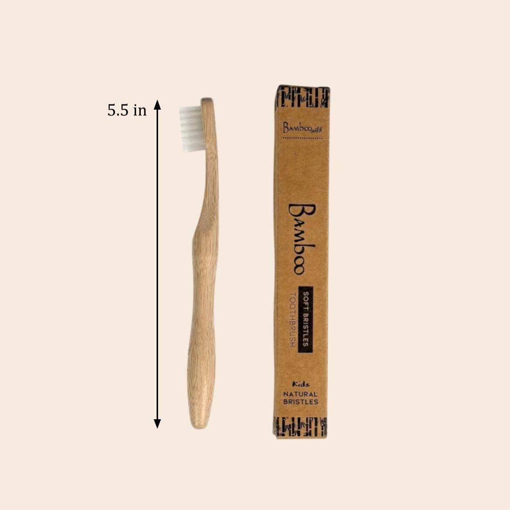 Bamboo toothbrush with packaging on a beige background
