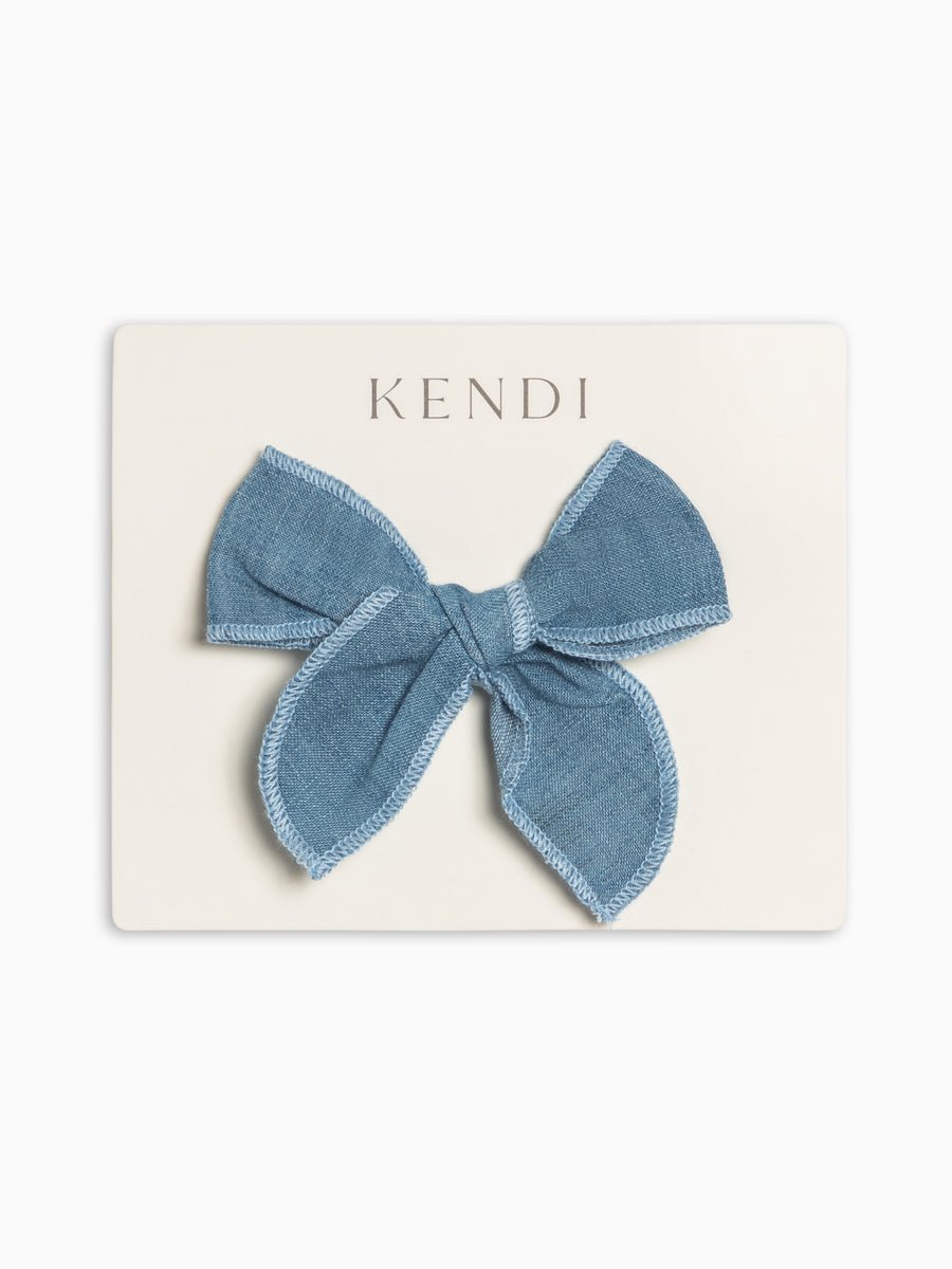 Blue denim bow on a Kendi branded card