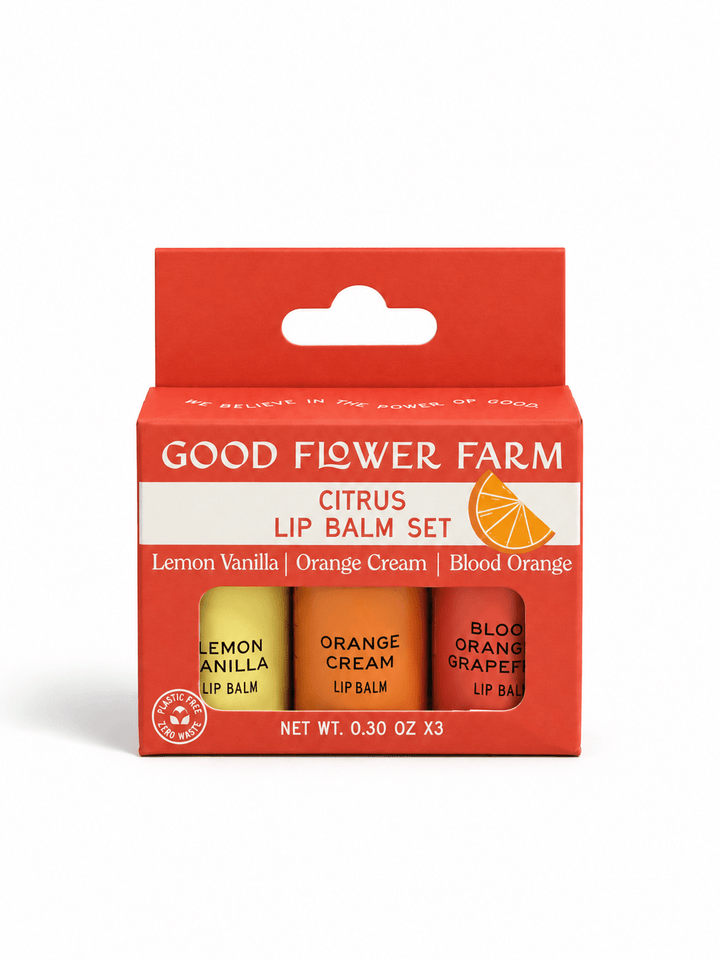Good Flower Farm Citrus Lip Balm Set in a red cardboard box containing three tubes: Lemon Vanilla, Orange Cream, and Blood Orange Grapefruit.