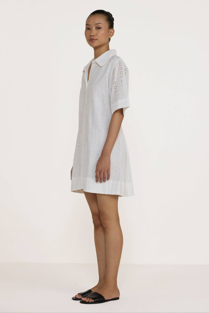 Woman wearing a Laude the Label Classic Shirt Dress in Ivory Lace on a white background