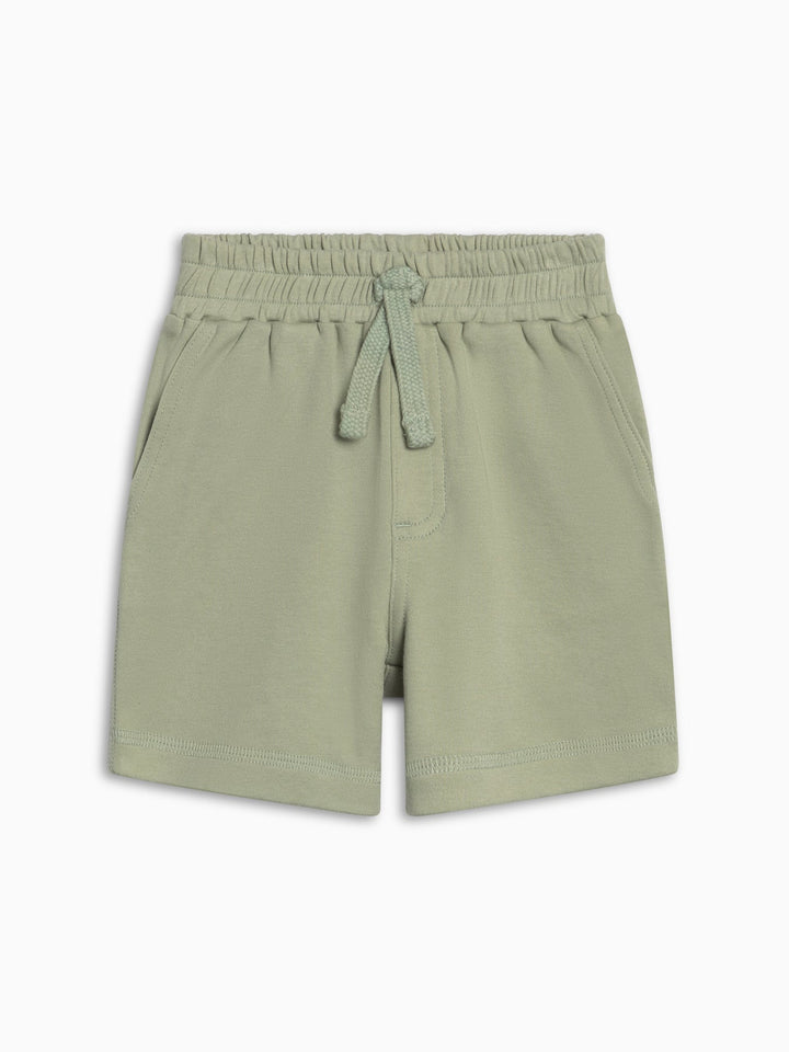 Green shorts with drawstring on a white background
