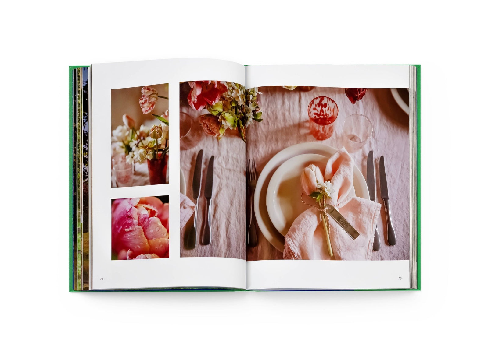 Open book showing a photo of a table setting with flowers and cutlery.