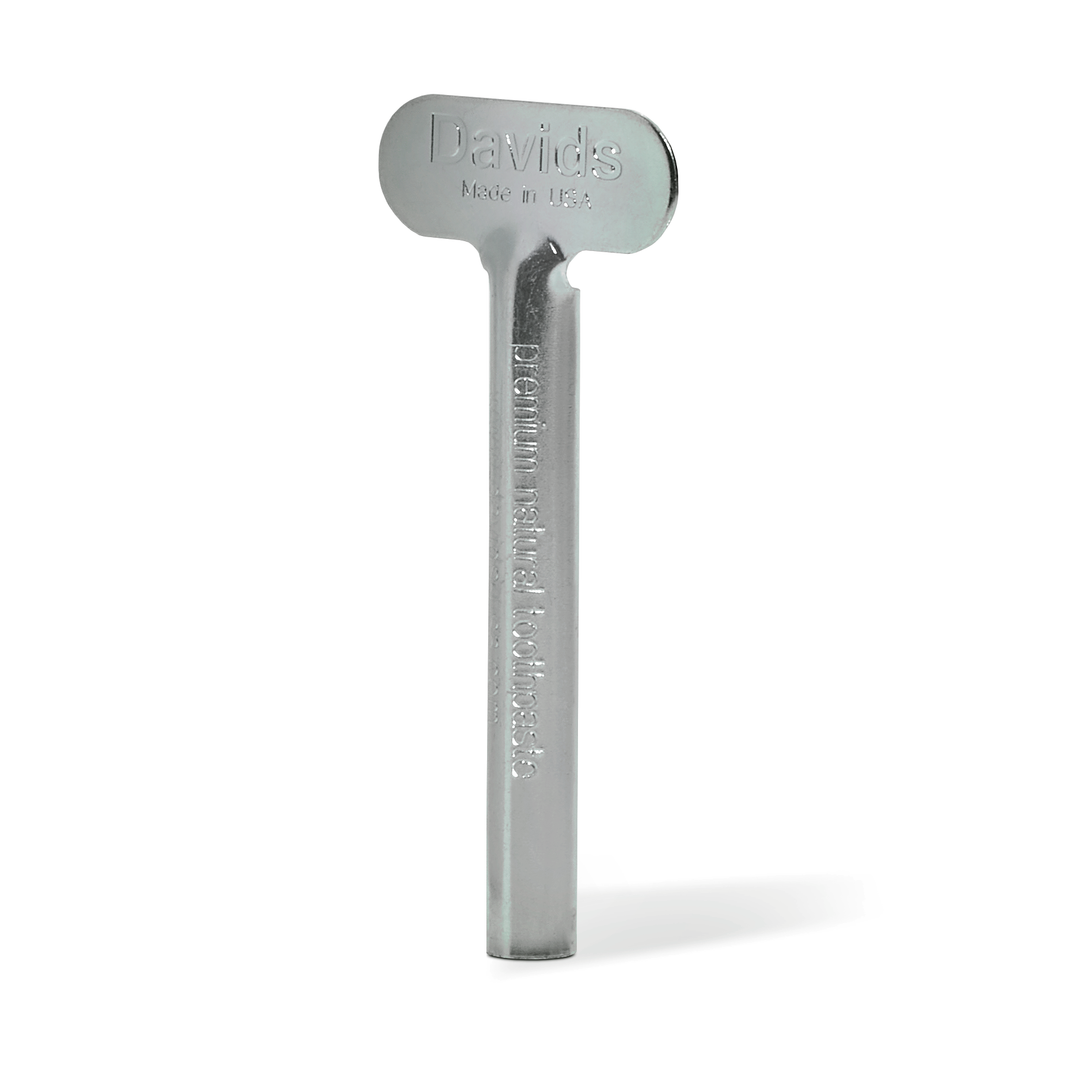 Metallic tube key with 'Davids' branding on a white background