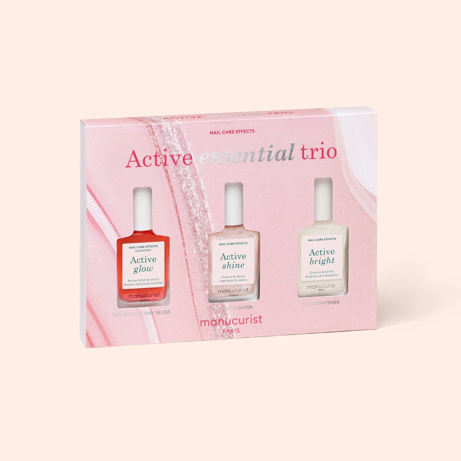 Manucurist Active Essential Trio nail care set with three bottles in a pink box on a light pink background