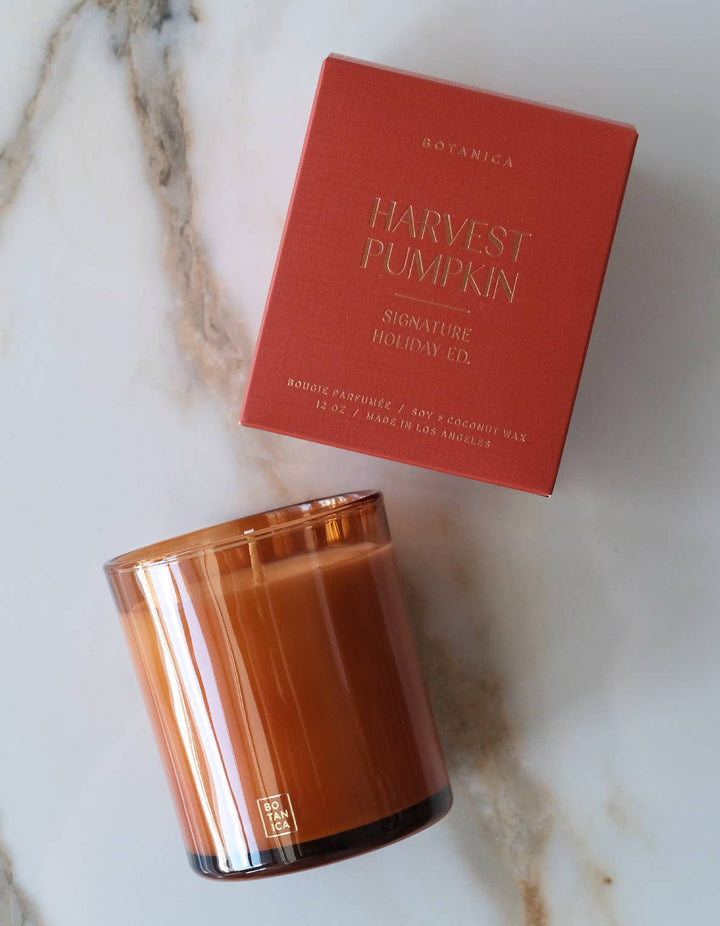 Harvest Pumpkin candle and packaging on a marble surface