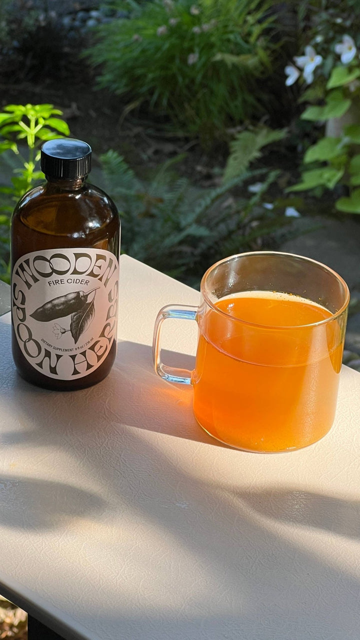 An amber glass bottle labeled &