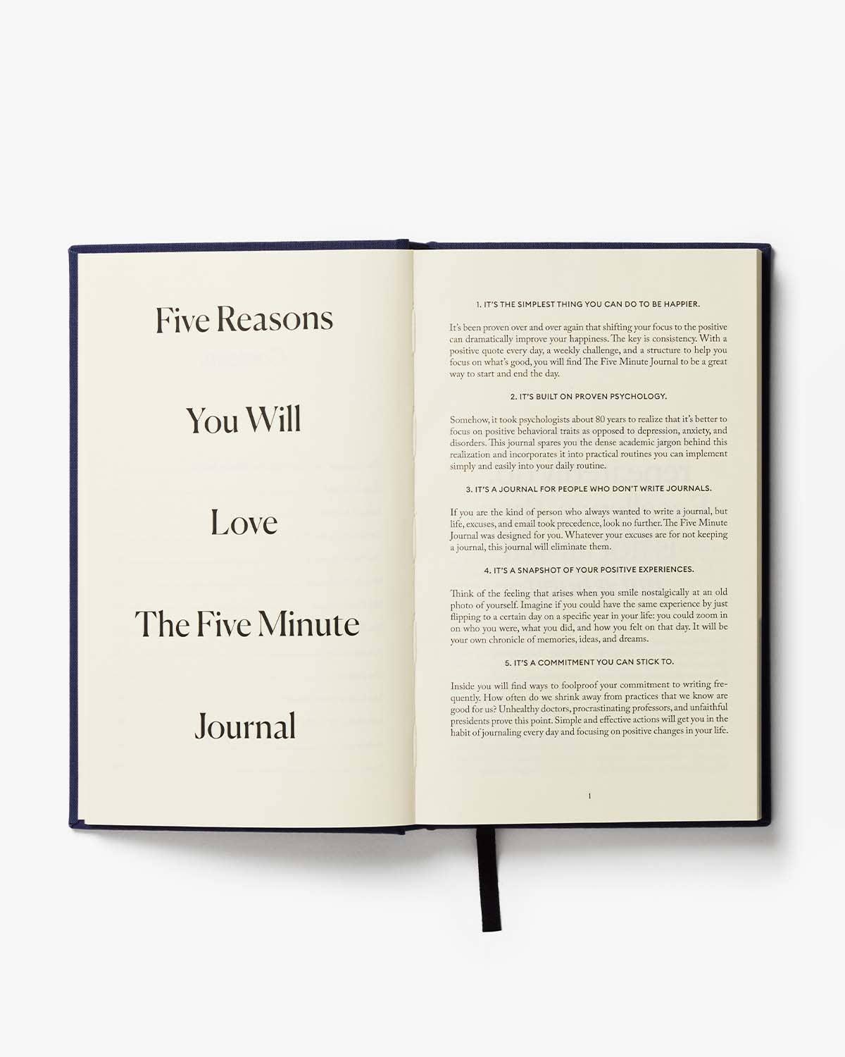 Open book titled 'The Five Minute Journal' on a white background