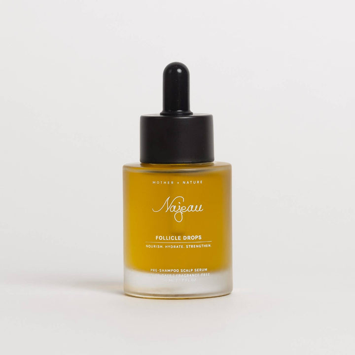 Bottle of Najeau follicle drops on a light gray background