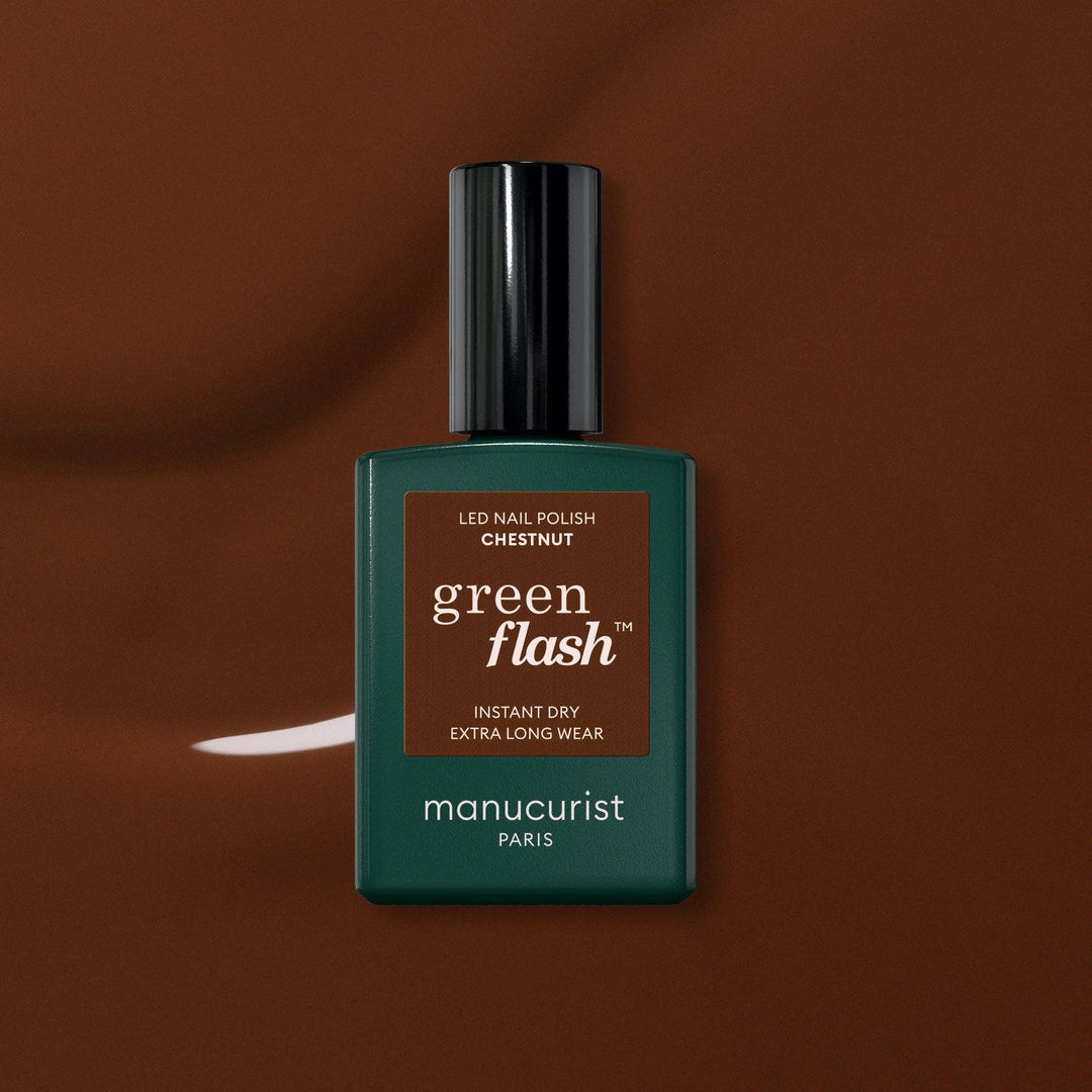 Green Flash nail polish bottle on a brown background