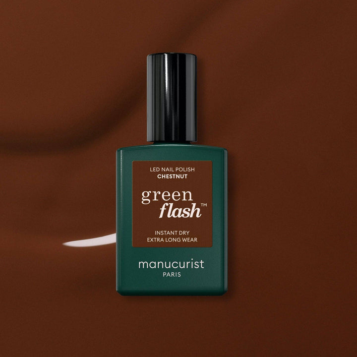 Green Flash nail polish bottle on a brown background