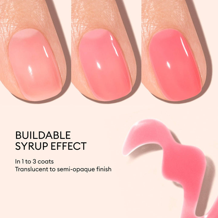 Close-up of pink nail polish on nails with text describing the buildable syrup effect.