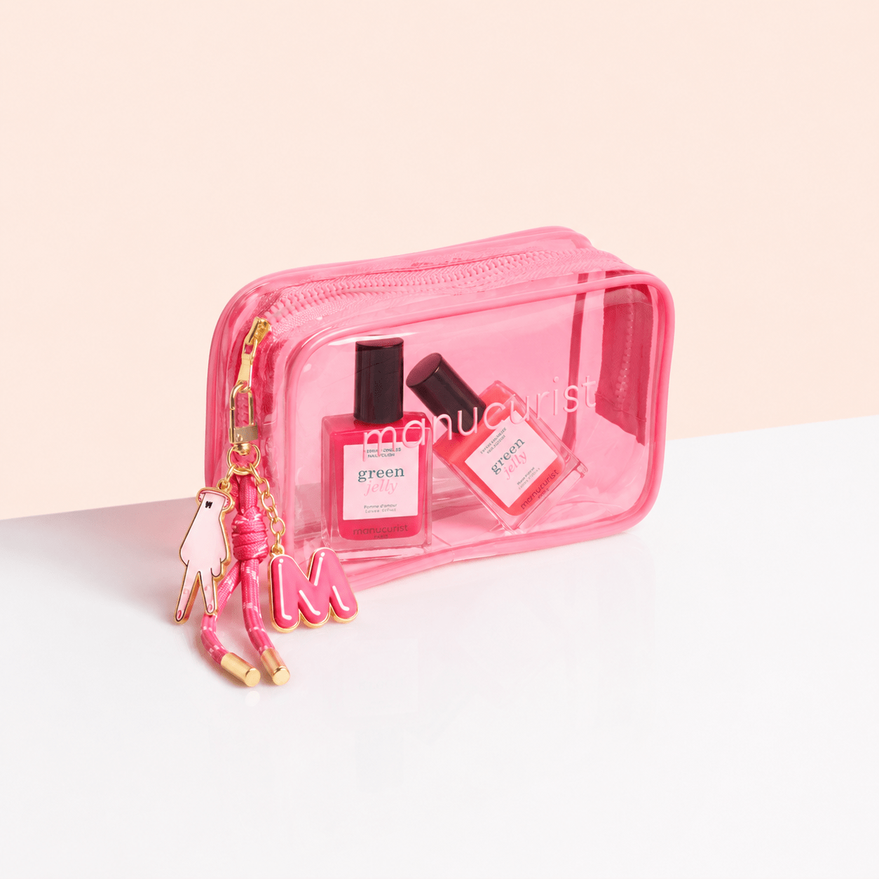 Manucurist Paris jelly nail set with pink mini bag and charms on a beige background