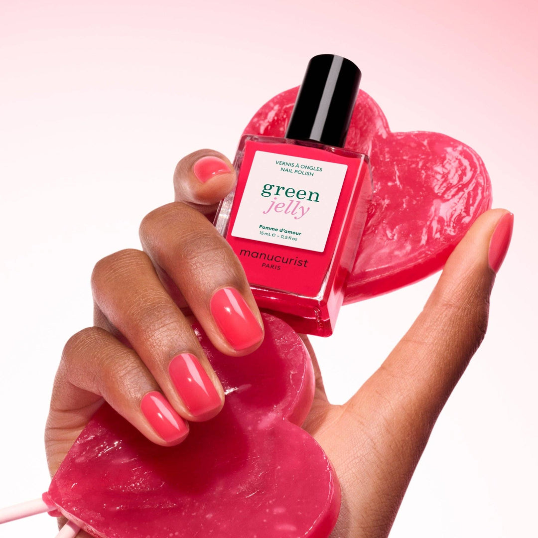 Hand holding a bottle of &