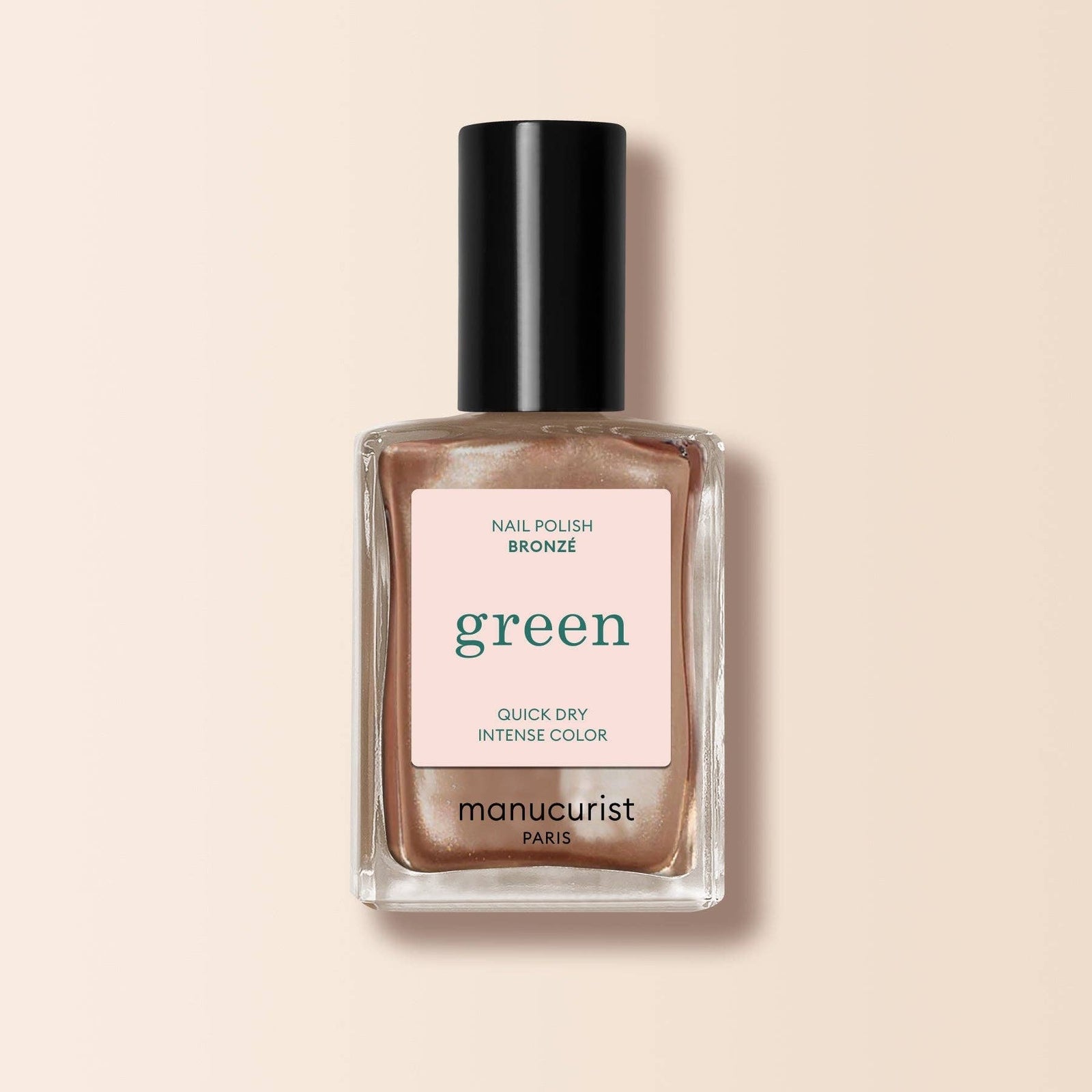 Manucurist nail polish bottle with bronze color on a beige background