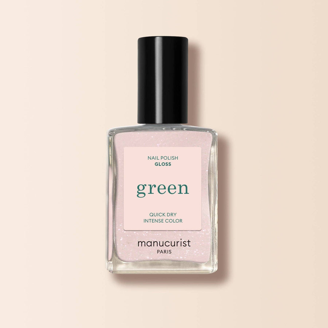 Manucurist nail polish bottle with pink label on a beige background